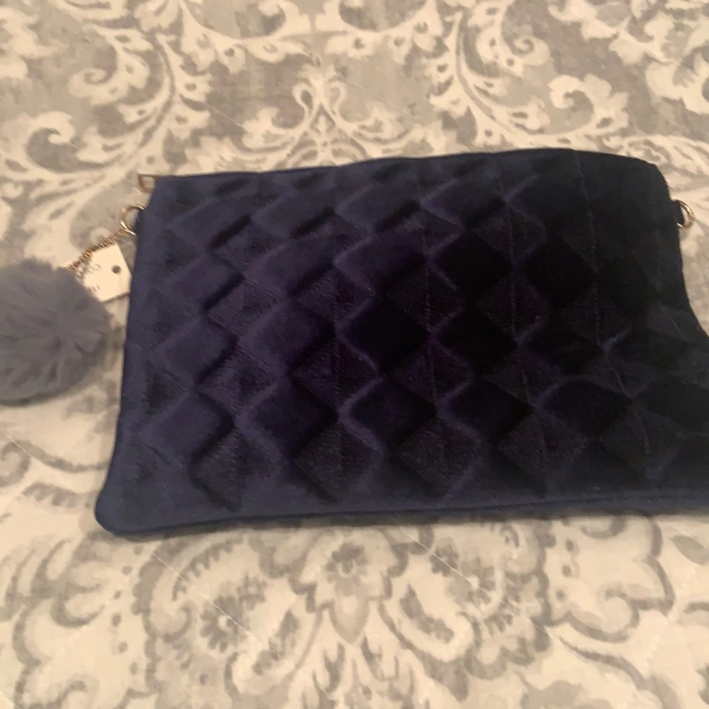 Women’s baby blue plush clutch NWT with gold chain to attach for shoulder strap